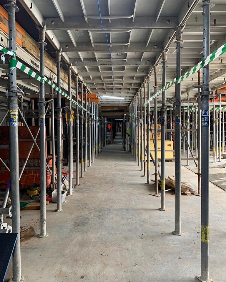 Rows of steel props supporting a suspended slab panel system